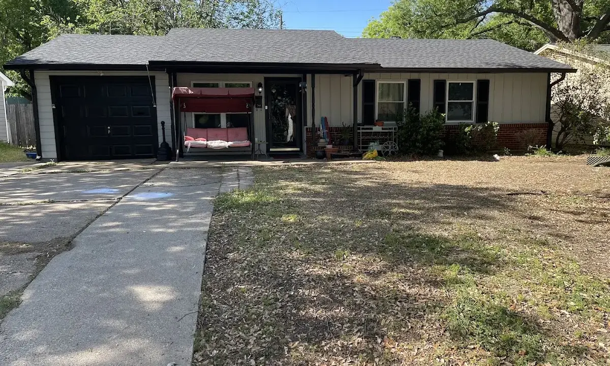 Metal Roof Installation crew at work on a residential roof in Conroe